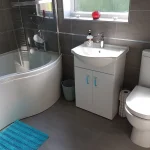 Bathroom with a Shower bath